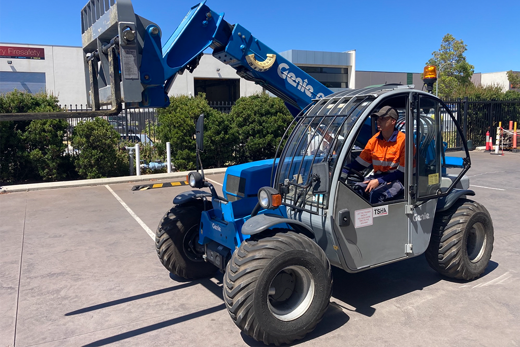 man driving a forklift