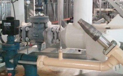 industrial refrigeration equipment including shut off valve, strainer, solenoid, suction stop in a plant room