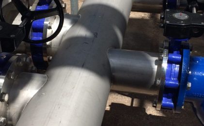close shot of valves and pipework in an industrial refrigeration site
