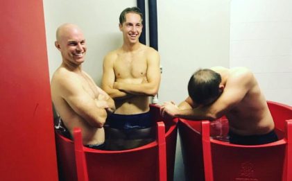 two ice baths with three men in them